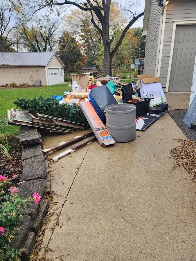 Dumpster being loaded with debris for Commercial Dumpster Rental in Rosamond